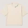 An off-white short-sleeve t-shirt with a small black script logo and heart outline on the upper right chest, displayed flat against a light gray background.