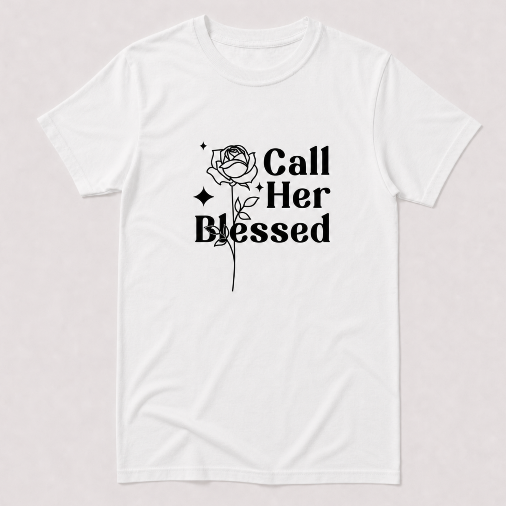 A white short-sleeve crewneck t-shirt with a black graphic print on the front featuring a rose and the text 'Call Her Blessed'.