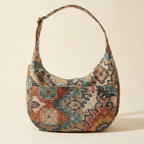 Multicolored patterned handbag on a beige background