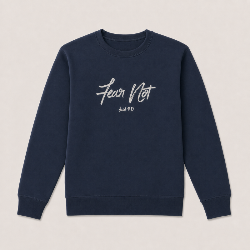 A navy blue crewneck sweatshirt with 'Fear Not' , displayed flat against a light beige background.