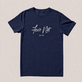 A navy blue short-sleeve t-shirt with 'Fear Not' and 'Isaiah 41:10' printed in white script on the chest, displayed flat against a light beige background.