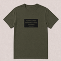 An olive green short-sleeve t-shirt with a black rectangular graphic on the chest containing white text that reads 'FEARFULLY MADE WONDERFULLY MADE GOD MADE PSALM 139:14'. The t-shirt is laid flat against a light beige textured background.