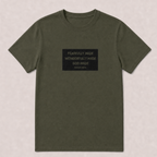 An olive green short-sleeve t-shirt with a black rectangular graphic on the chest containing white text that reads 'FEARFULLY MADE WONDERFULLY MADE GOD MADE PSALM 139:14'. The t-shirt is laid flat against a light beige textured background.