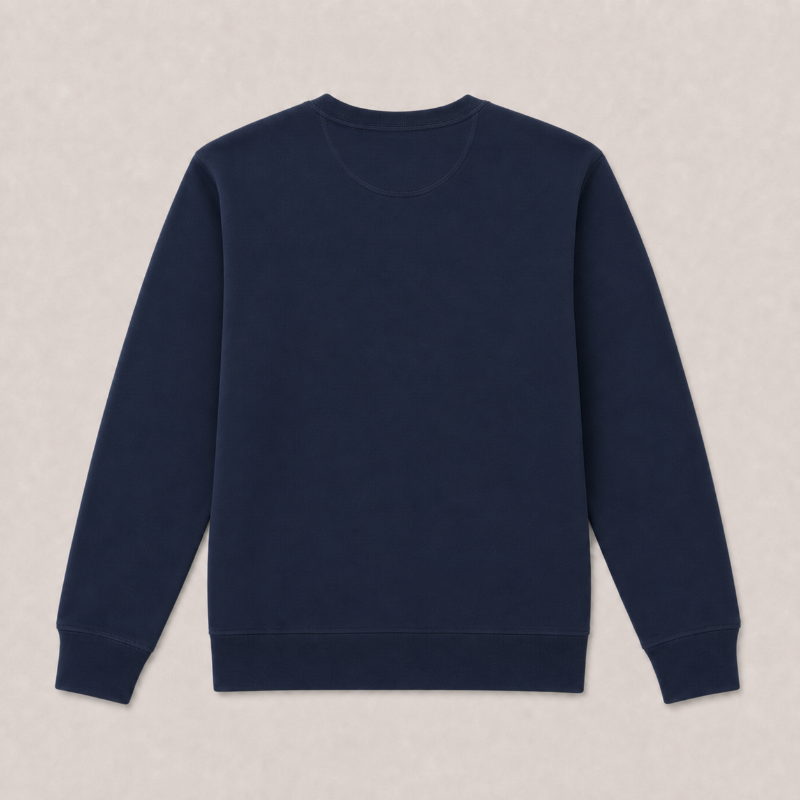 A plain navy blue crewneck sweatshirt laid flat against a light beige textured background.